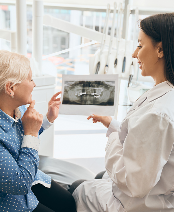 patient and dentist reviewing scans