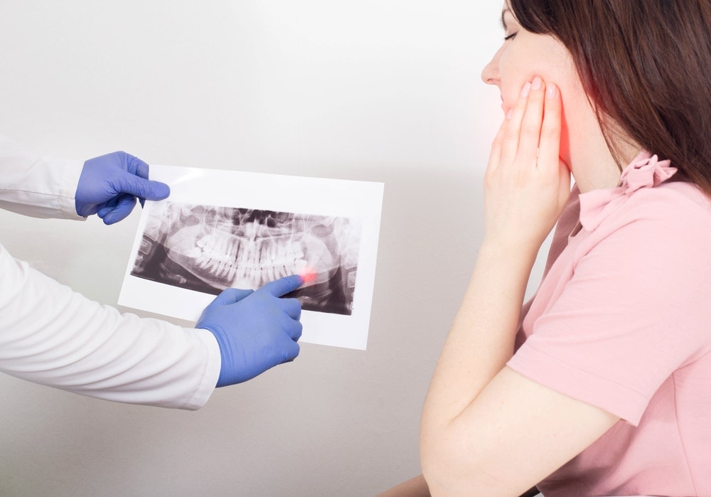 dentist showing a dental xray
