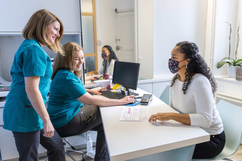 team members at the office front desk