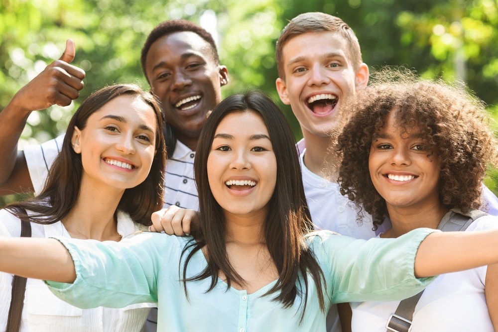 group of friend smiling outside