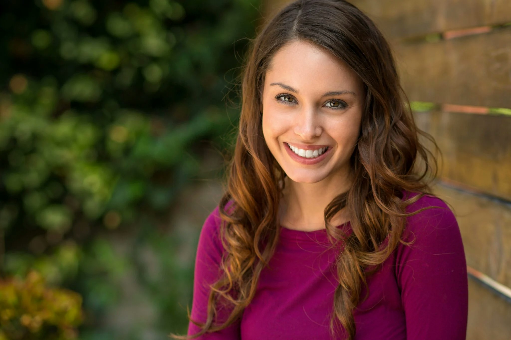 young woman with brown hair smiling