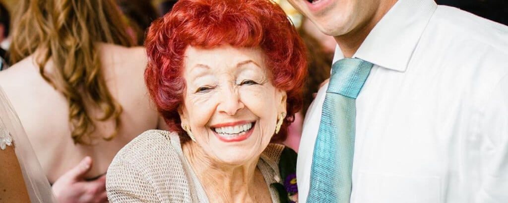 Older woman with red hair smiling