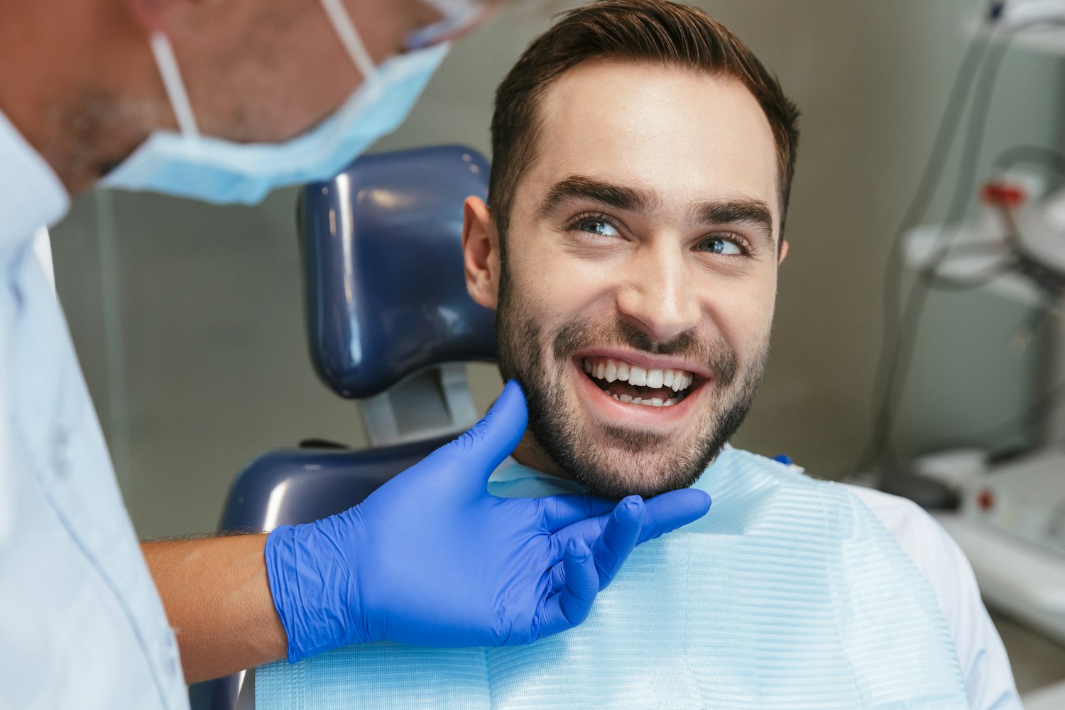 Smiling dental patient in the exam chair