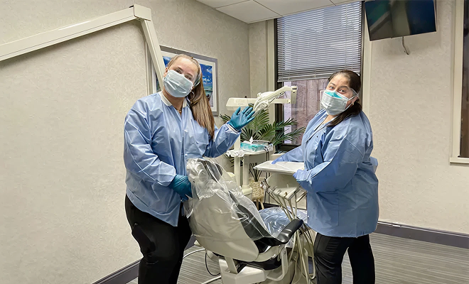 Staff in dental exam room