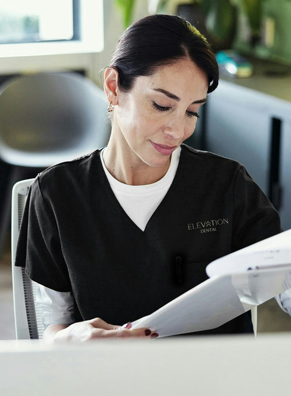 staff member reviewing paperwork