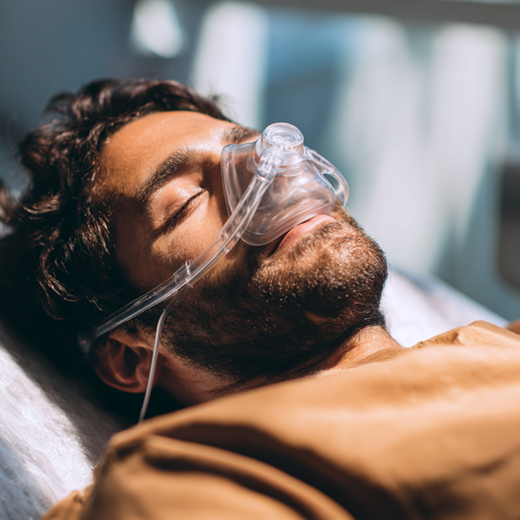 Patient relaxing in a dental chair with a nitrous oxide mask