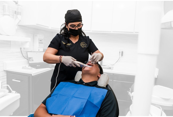 Dr. Cota treating a patient