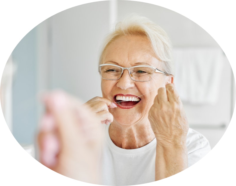 Senior woman brushing teeth