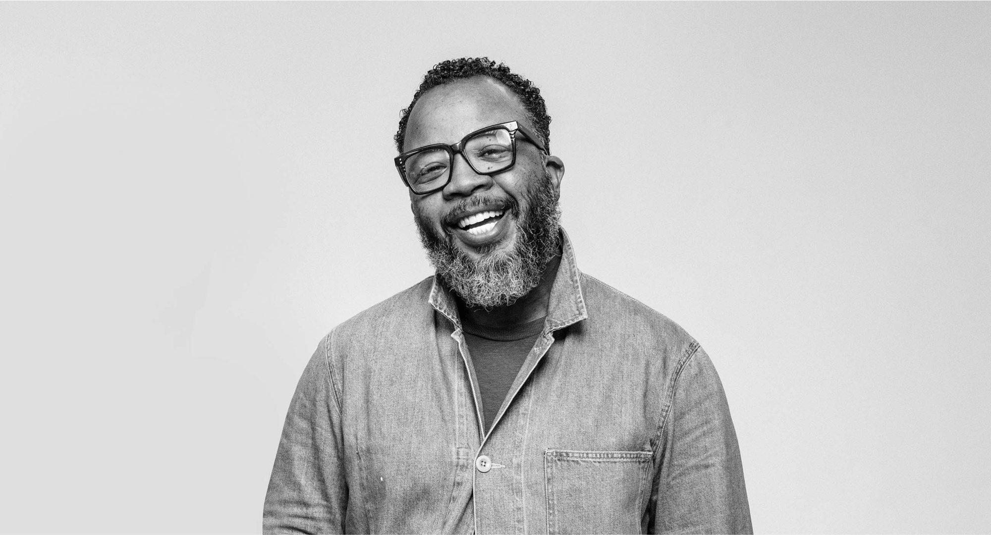 middle aged man with glasses smiling - real Smile Code patient