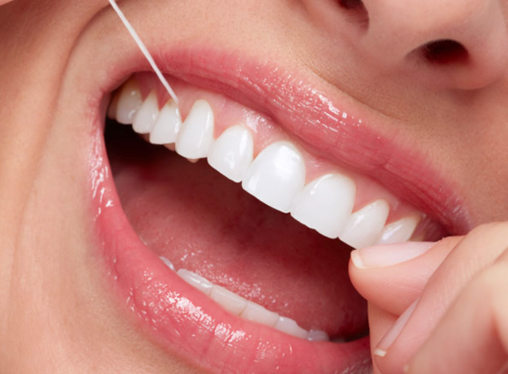 close up on woman flossing