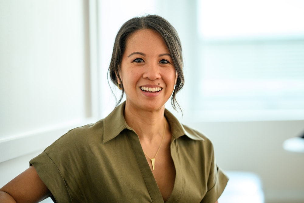 smiling woman in green