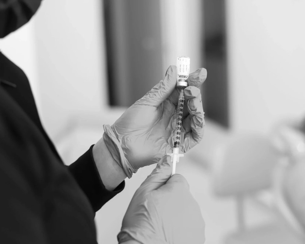 BOTOX being pulled from a bottle
