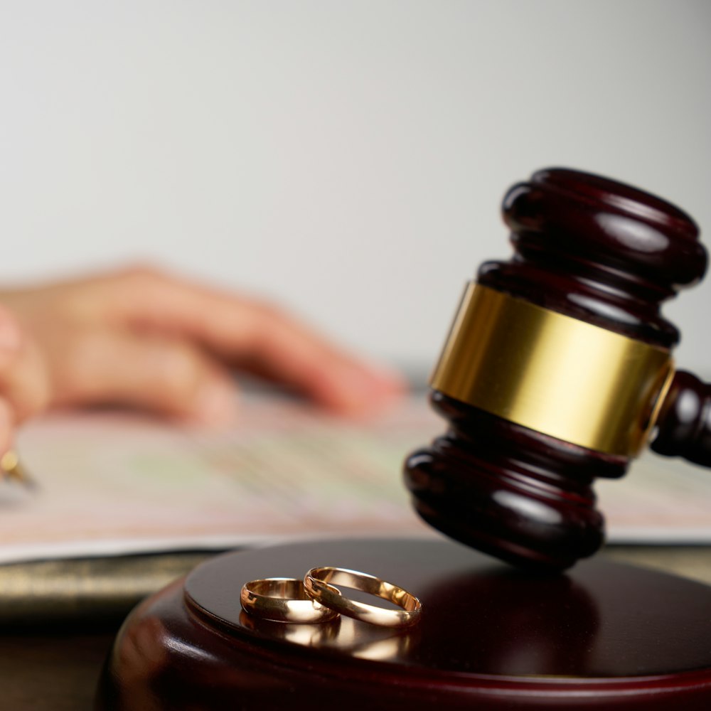 Gavel and wedding rings