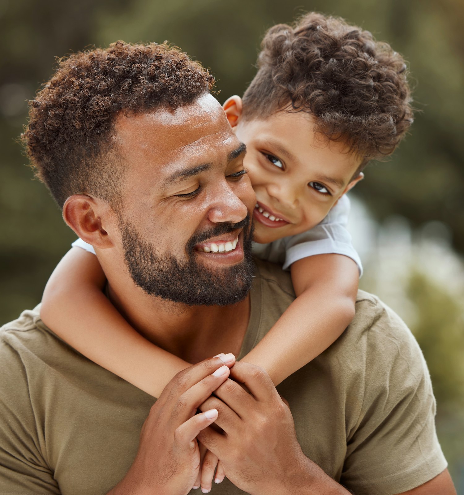 man giving his son a piggyback ride