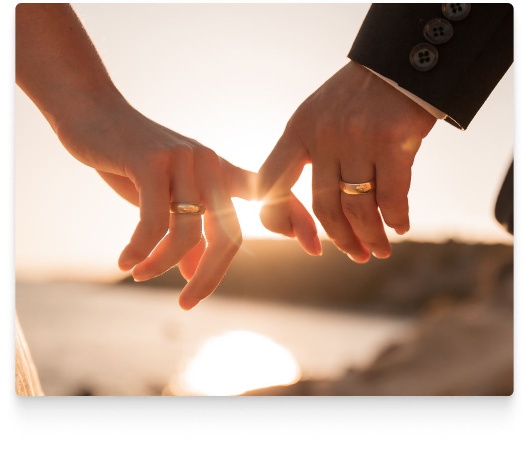 married couple linking fingers