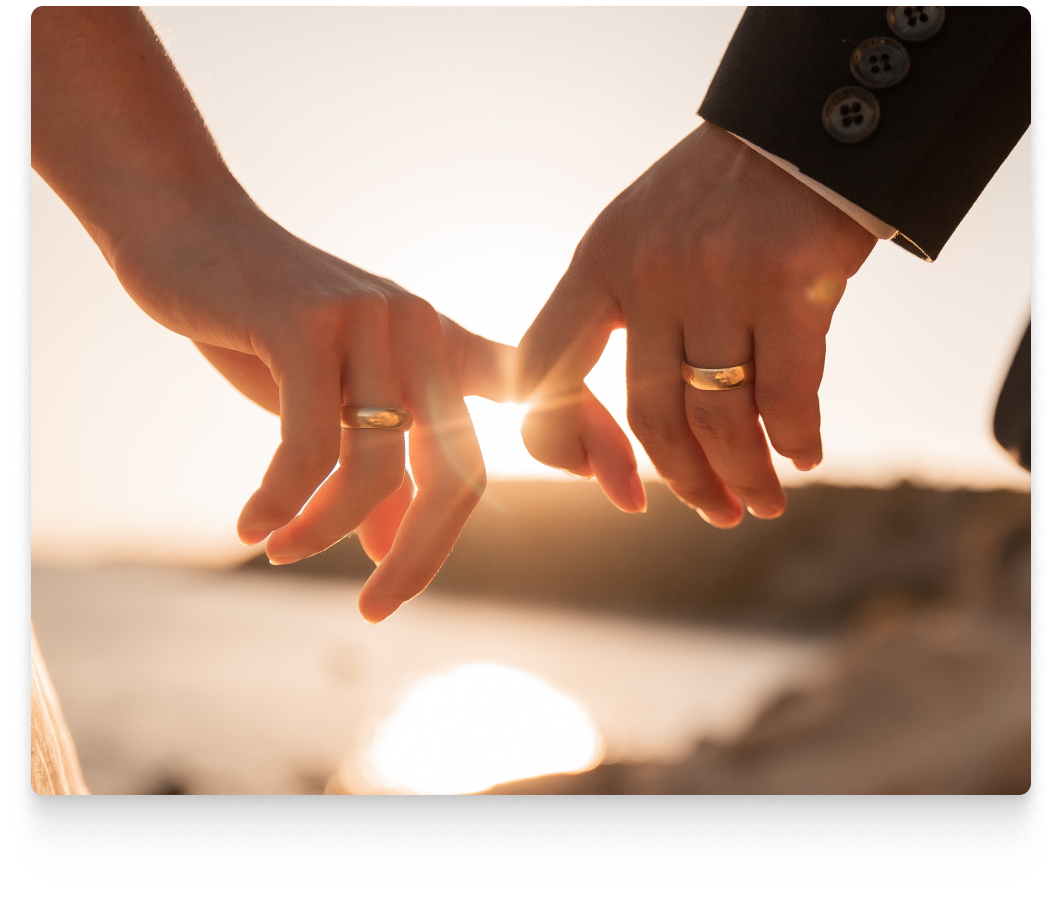 married couple linking fingers