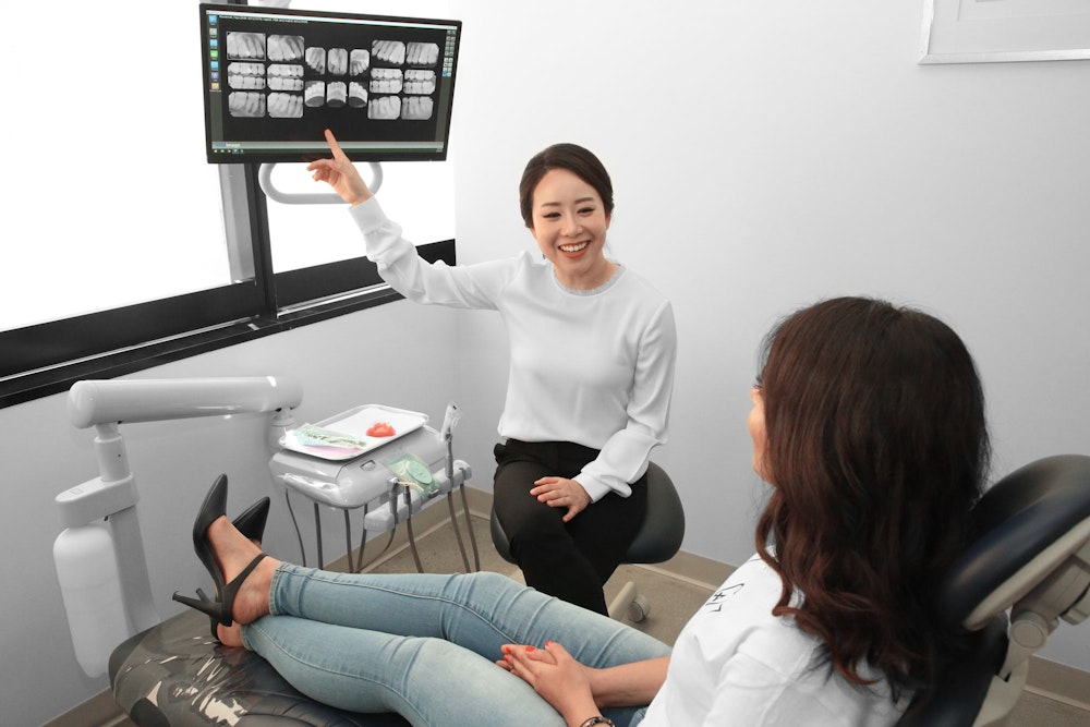 Dr. Oh showing scans to a patient