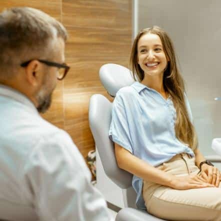patient in chair with dentist