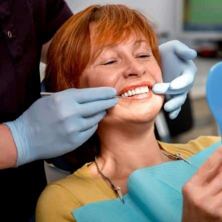 happy woman in dental chair