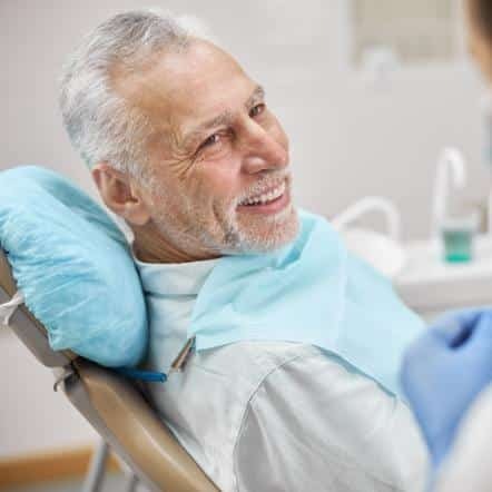 man smiling in dental chair