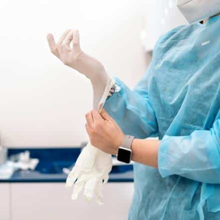 doctor putting on gloves