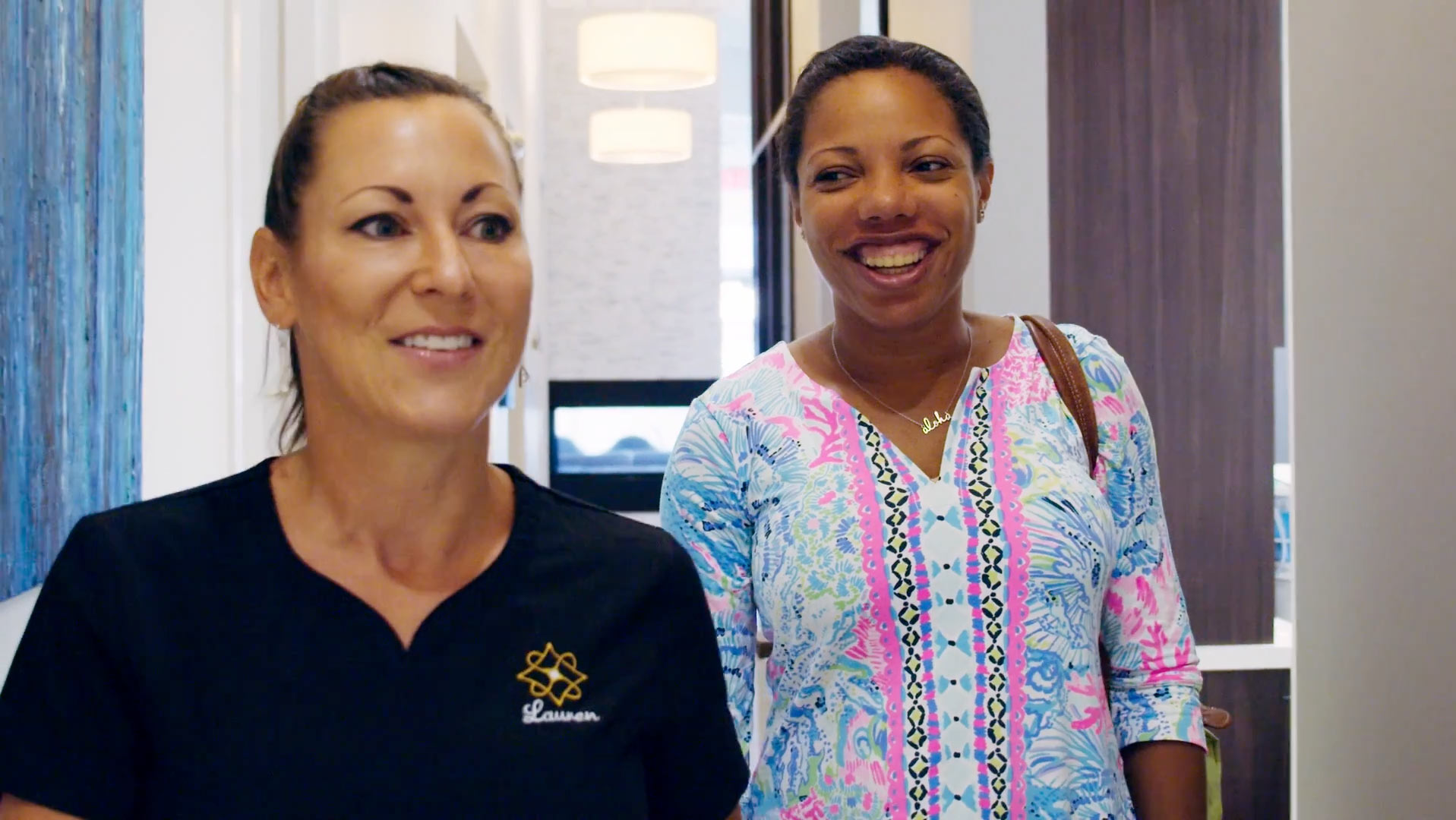 smiling patient and assistant