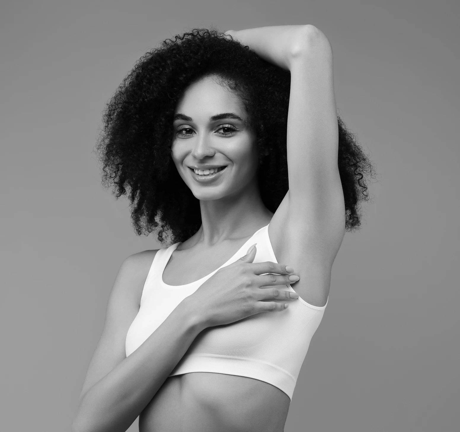 woman holding her arm over her head