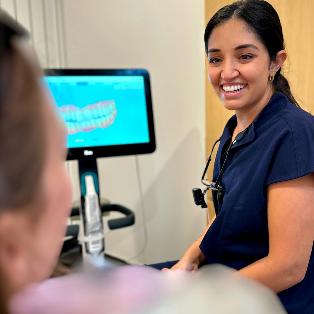 Smiling staff in a patient consult