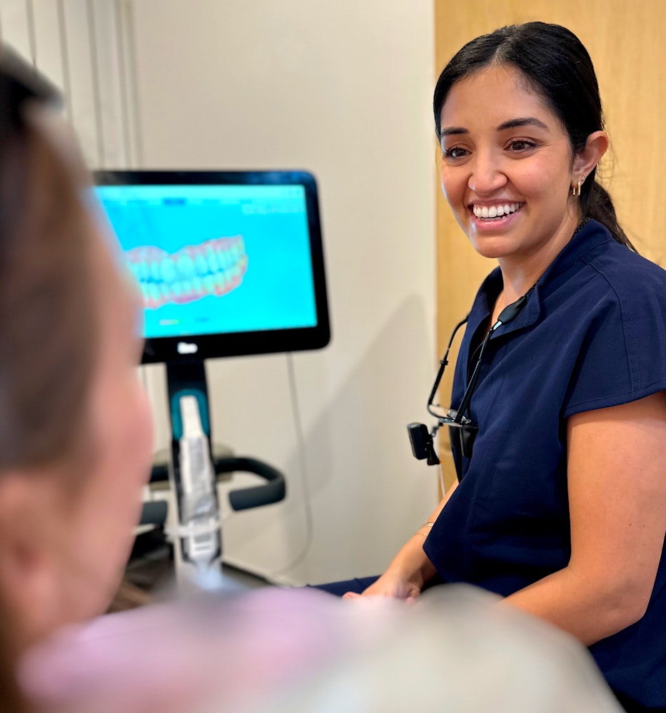 Smiling staff in a patient consult