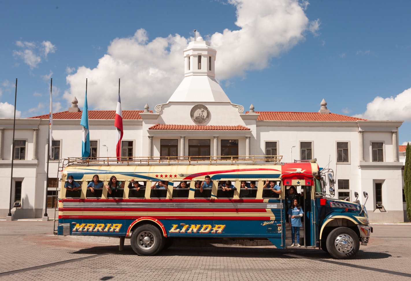 Bus full of kids smiling