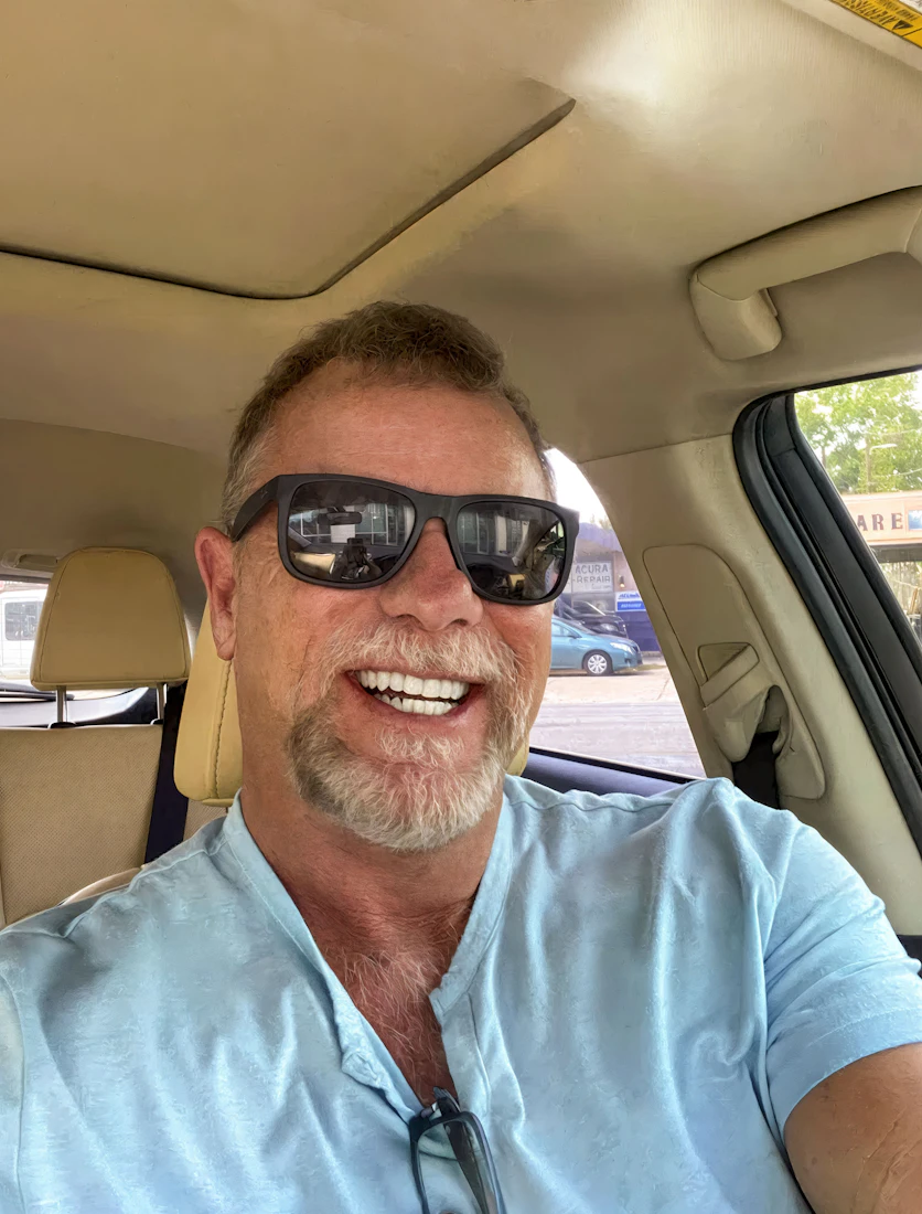 smiling man with bright white teeth