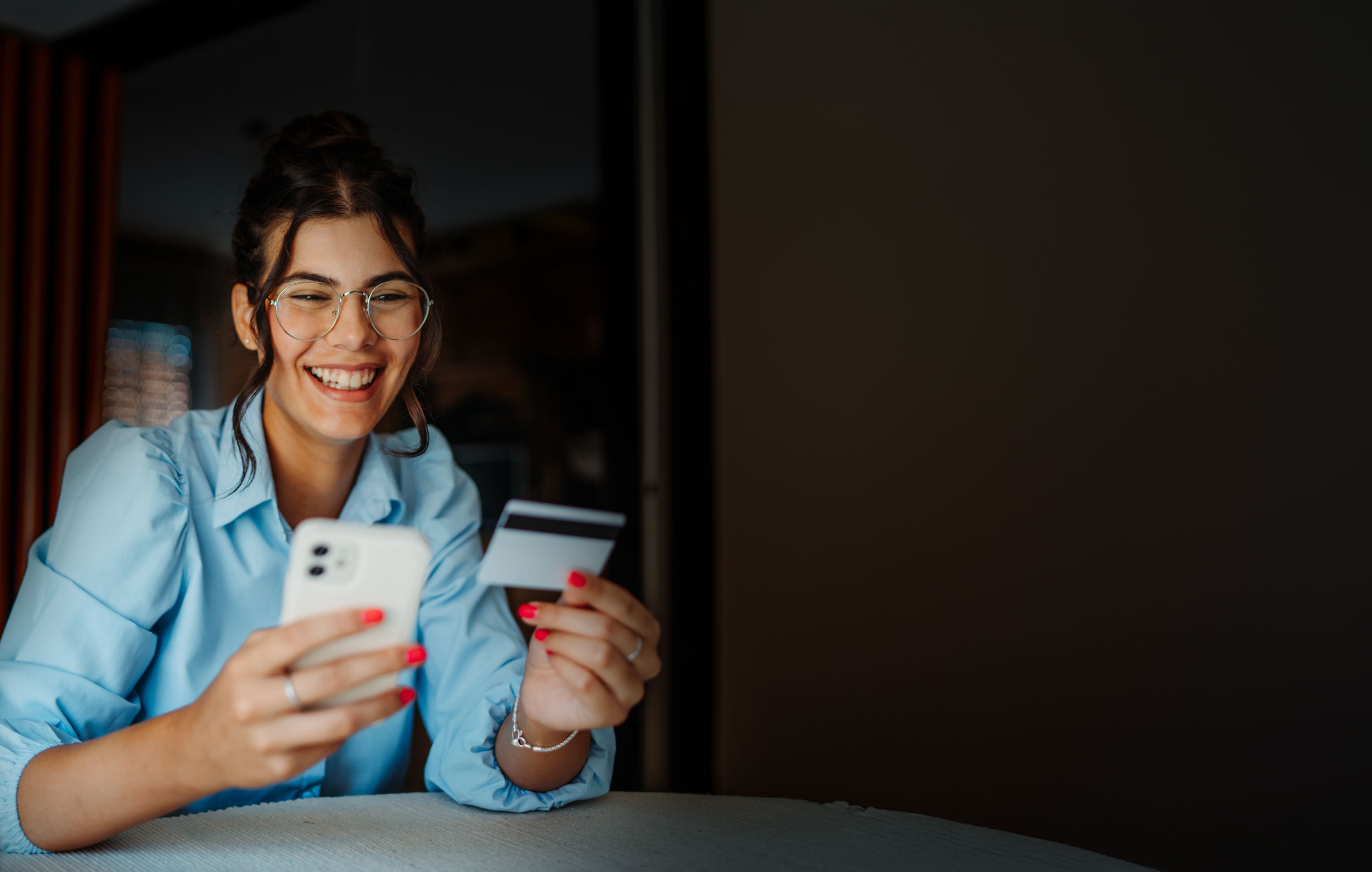 woman paying for her dental care on her phone