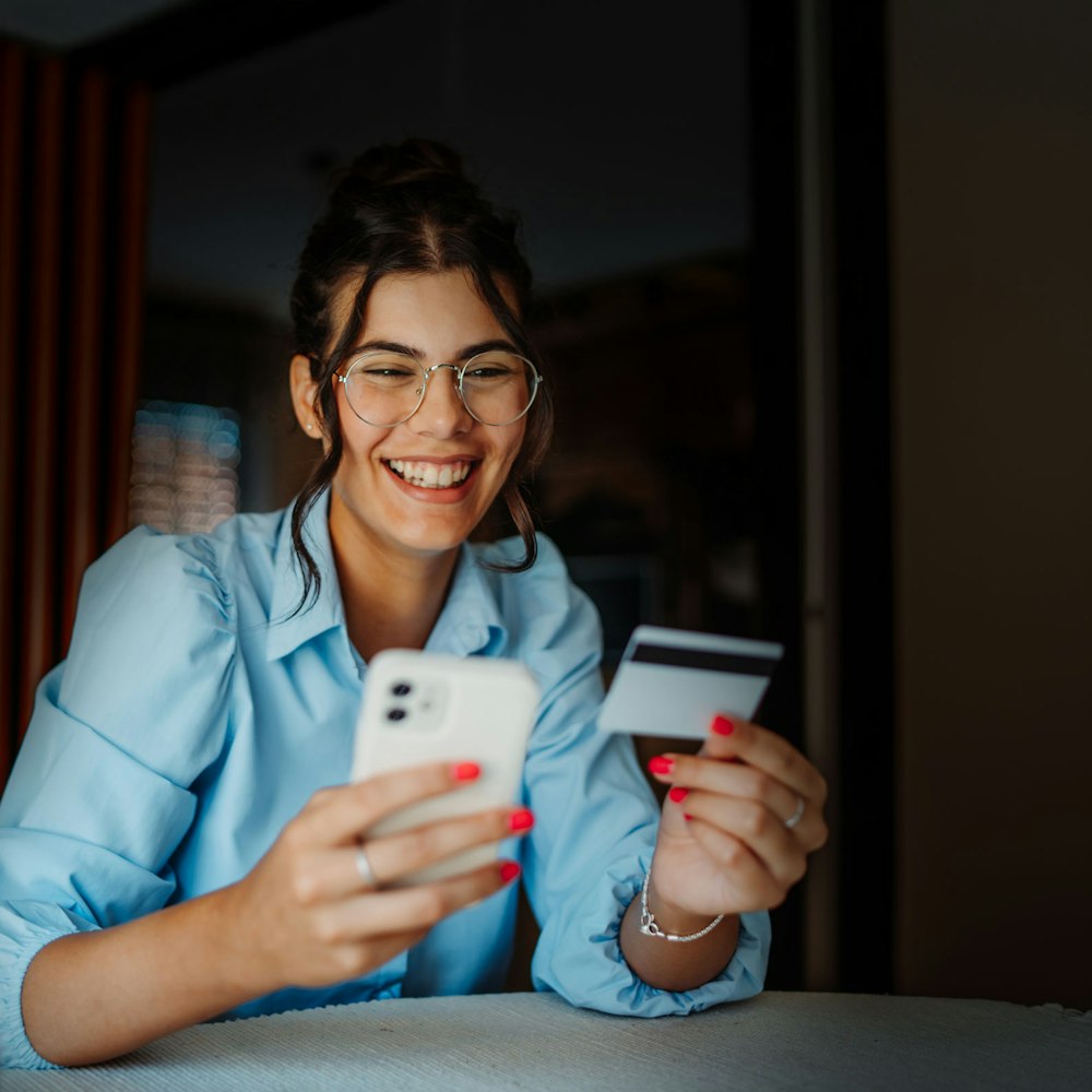 woman paying for her dental care on her phone
