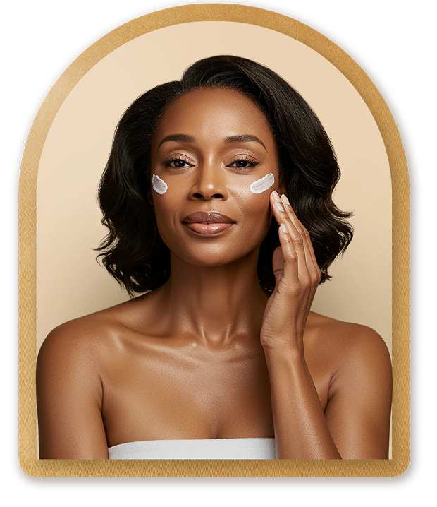 Beautiful woman applying cream to her face