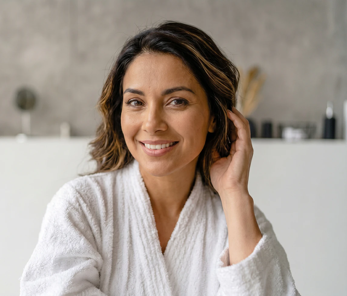 Woman in a robe smiling