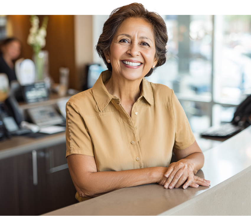 smiling woman in yellow shirt