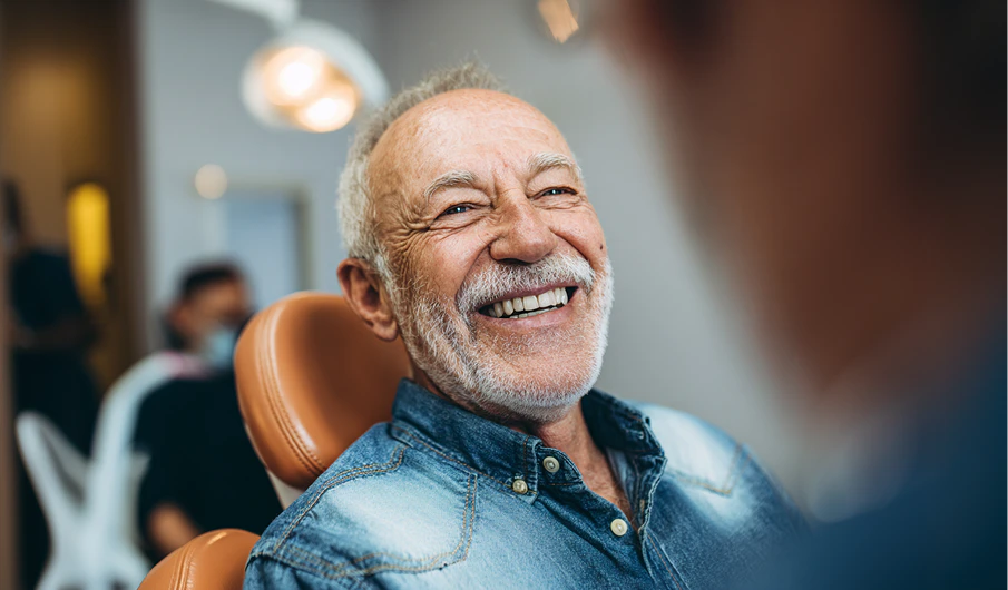 Older man smiling during exam
