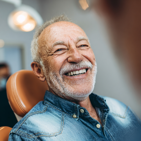 man smiling in the dental chair