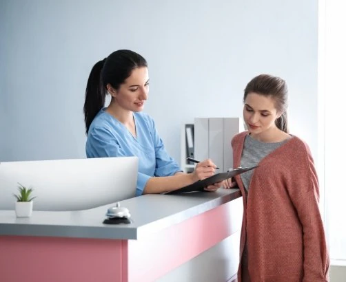 patient looking at paperwork