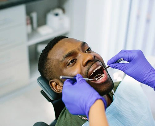 man getting dental exam