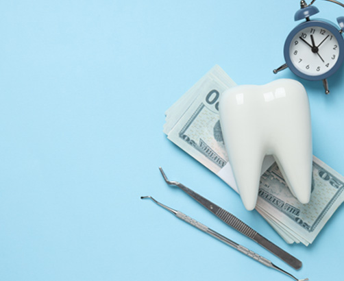 money with tooth on top