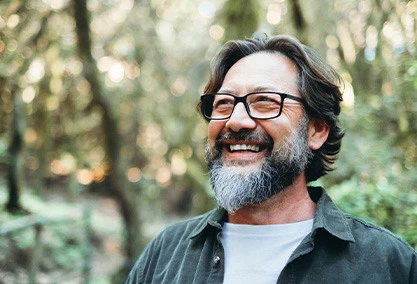 Man smiling outside