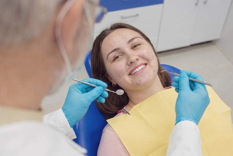 Woman getting dental exam