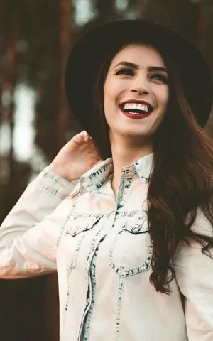 woman in hat smiling