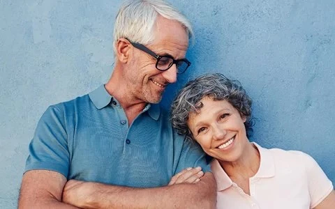 man and woman smiling
