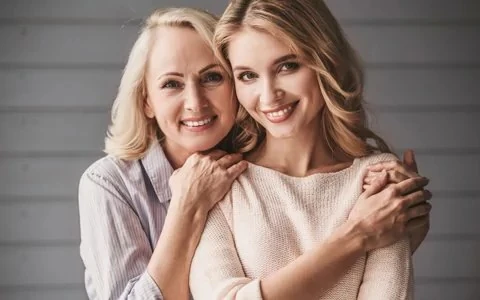 Smiling mother and daughter