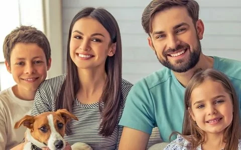 Happy parents, kids, and dog