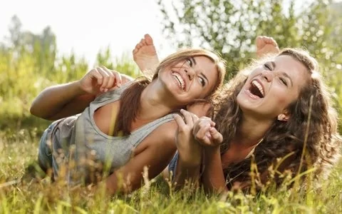 Laughing mother and daughter