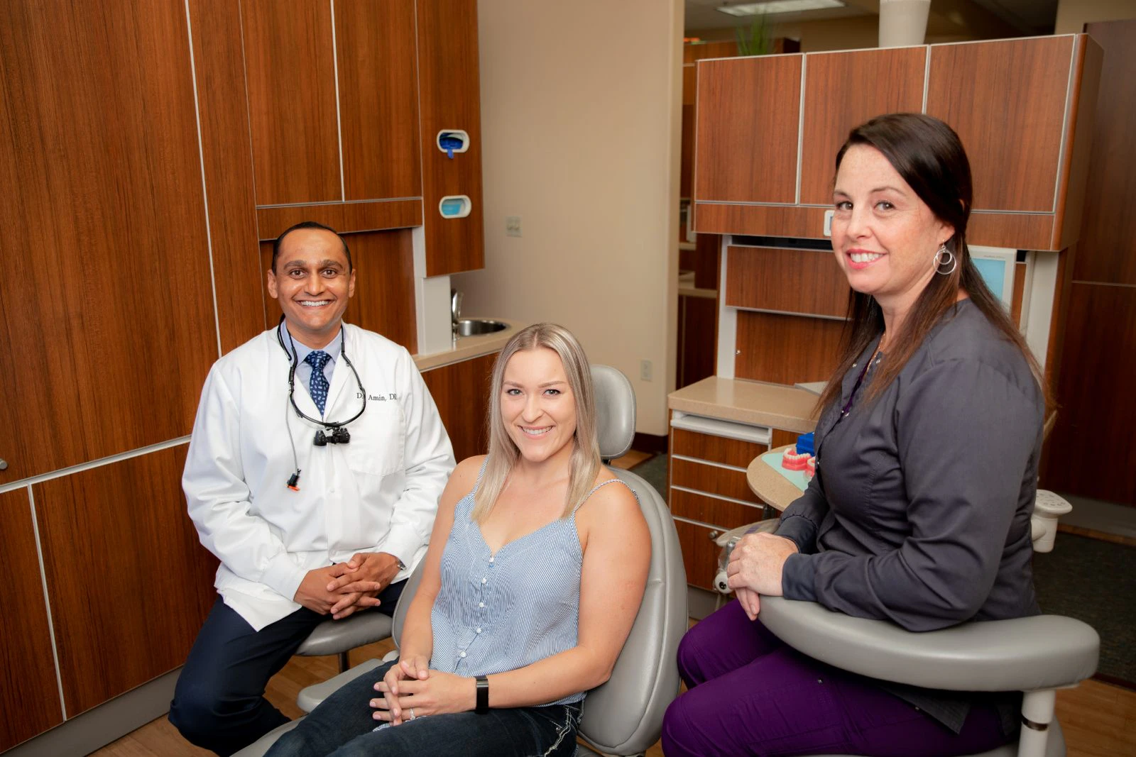 Doctor, patient and staff member in office