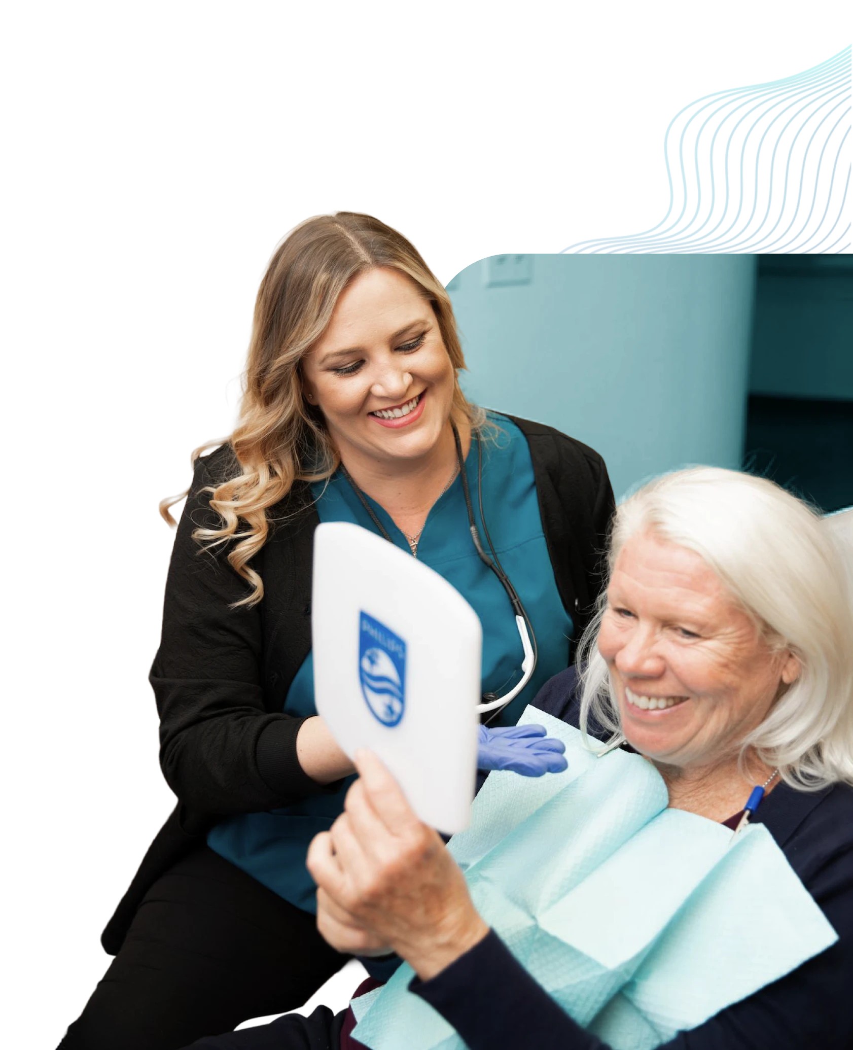 A patient admires her new smile